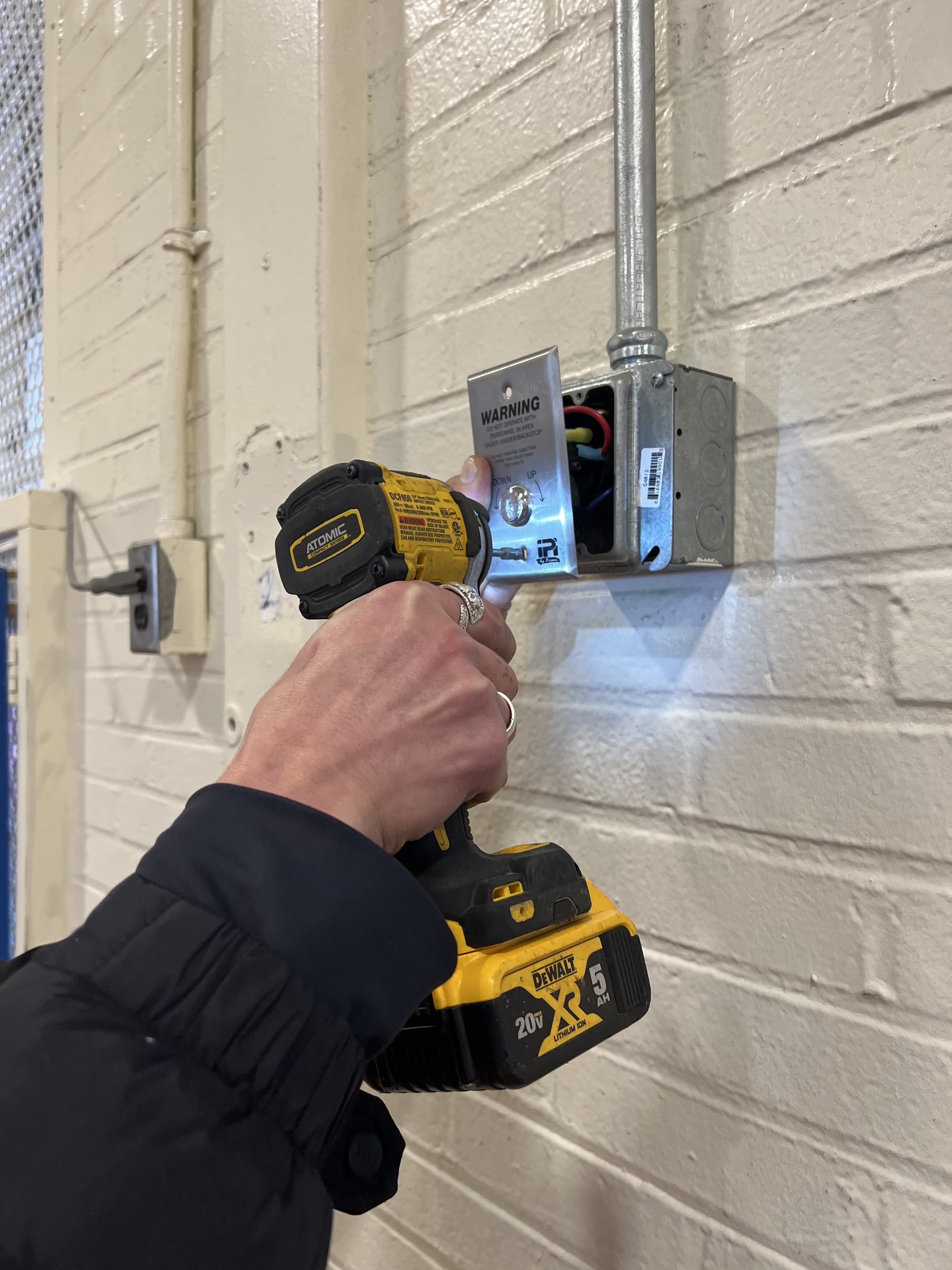 Completed access control strike installation wired at the door frame
